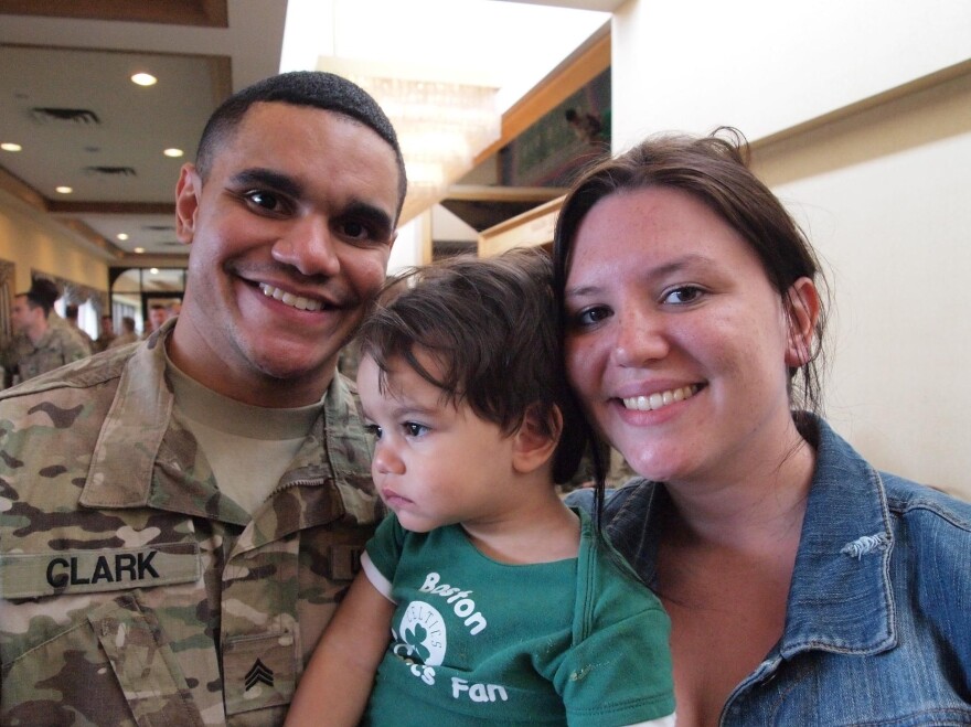 Sgt. Michael Clark and his fiancee, Kaitlin Forant, hold their son, Michael Clark Jr. It took time for the 18-month-old to recognize his father after Clark's deployment.