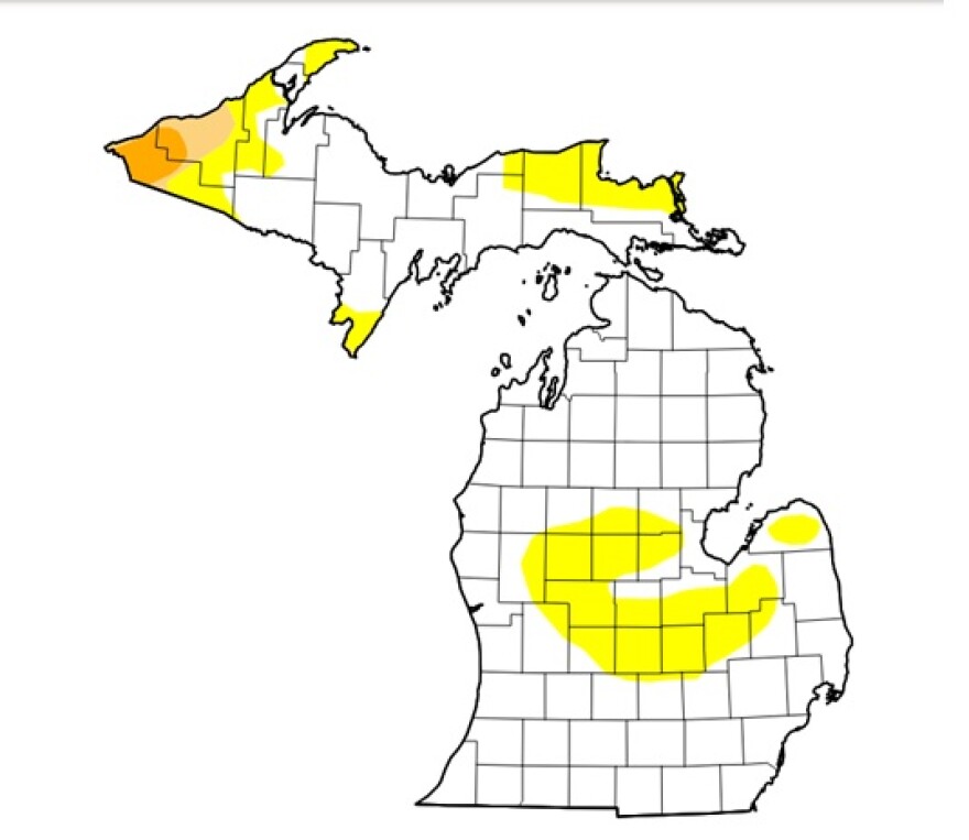The U.S. Drought Monitor map of Michigan showing patches of yellow marking abnormally dry areas and a few spots of orange making drought conditions in the Upper Peninsula.
