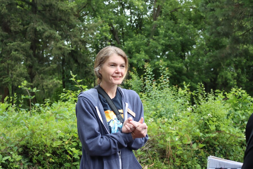 Katie McInnis, a veterinarian with the Cascades Raptor Center, led the mission to renest the fallen eaglet on June 8, 2026.