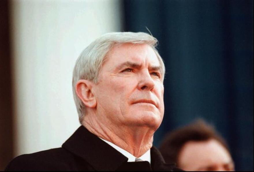 Nevada Governor Kenny Guinn sits on the stage at the state Capitol in Carson City, Nev., during his oath of office inauguration ceremony, Monday, Jan. 4, 1999.