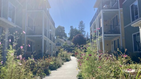 The central path at Haystack Heights winds through condos towards a common house in the back. A community joke says it takes an hour to walk from your car to your door because of all the neighbors you'll say hi to along the way.