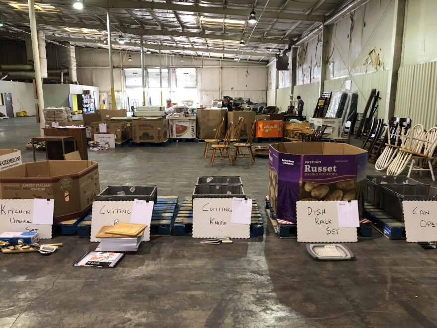 Donated items are sorted in a warehouse for incoming families.