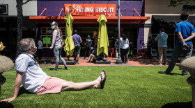 File photo of Dan Meyer, left, of Raleigh, NC, waiting to pick up a Mother's Day brunch at Flying Biscuit in Raleigh's Cameron Village. 