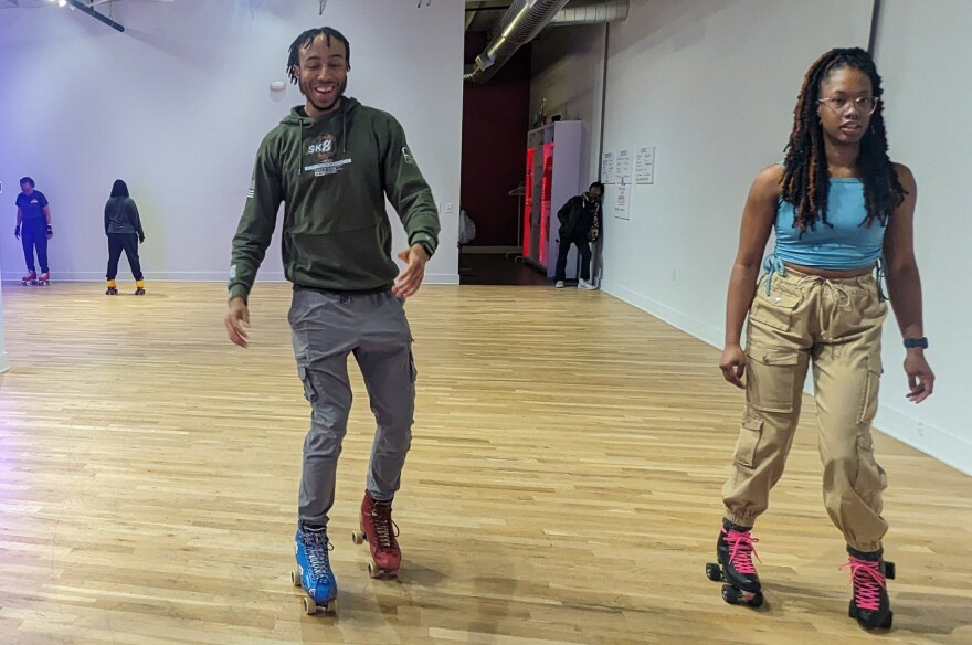 Knejie Allen, left, and Erica Culler during a Wednesday evening basic fundamentals class at SK8 Shot Studios in North Kansas City on Feb. 1. Allen was teaching a move called "the bubble."