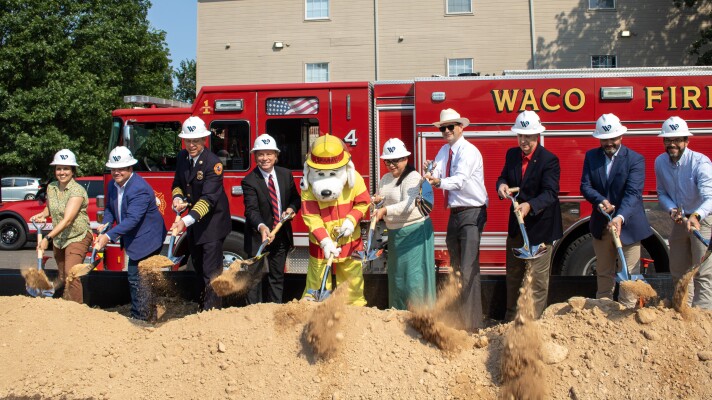 Members of Waco City Council and city staff, including Fire Chief Robby Bergeron, turn over the ceremonial first shovels during the groundbreaking for Station 4's new location on LaSalle Avenue.