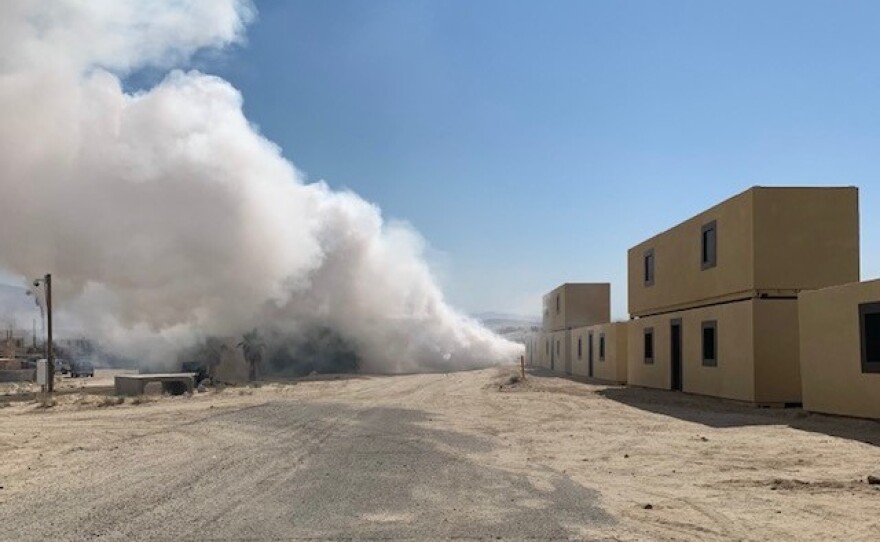 Smoke billows up at the mock village of Seize Razish.