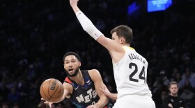 Brooklyn Nets guard Ben Simmons, left, moves the ball around Utah Jazz center Walker Kessler (24) during the first half of an NBA basketball game, Monday, Jan. 29, 2024, in New York. (AP Photo/Mary Altaffer)