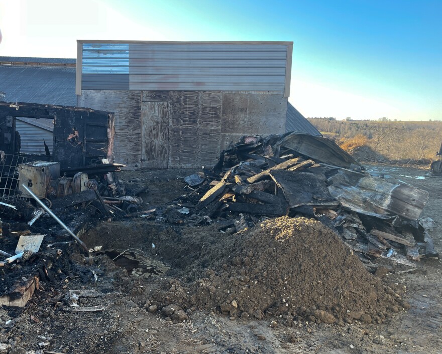The remnants of a barn fire at Aghaloma Farms in Knox on Wednesday.