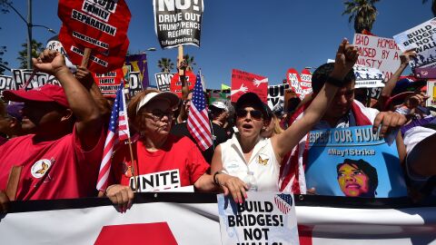 Protesters march against President Trump's immigration policy in Los Angeles on Monday, where tens of thousands are expected to take to the streets on May Day.