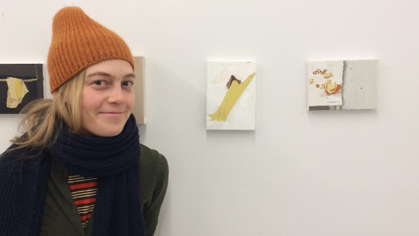 Artist Mollie Douthit, pictured with small paintings on display for Open Studios at Vermont Studio Center in Johnson, VT, November, 2018.