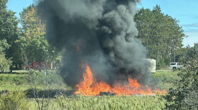 Fire burning after the military plane crash. The plane went down shortly before 2pm on Thursday.