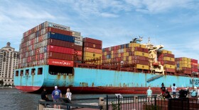 A large container ship sailing into the port of Savannah, GA