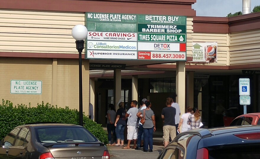 Customers line up outside a Division of Motor Vehicles office in Forsyth County. KERI BROWN/WFDD