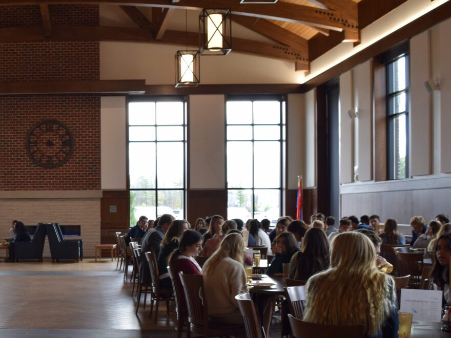 High school students at lunch in the University School of Milwaukee's cafeteria. Students are assigned seats, along with staff, to foster a positive school culture.