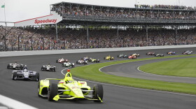 FILE - In this May 26, 2019, file photo, Simon Pagenaud, of France, leads the field through the first turn on the start of the Indianapolis 500.