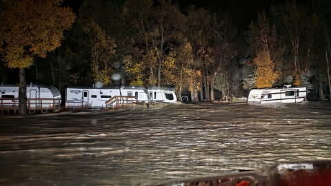 Floodwaters surround trailers at the Fun Valley Family Resort campground and RV part in South Fork, Colo., early Friday, Oct. 23, 2026.
