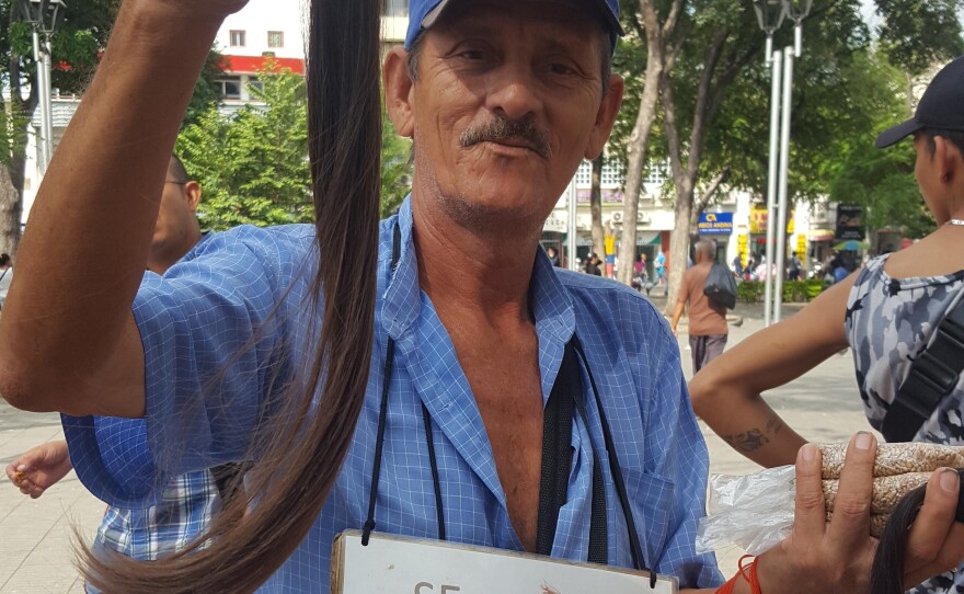 All sorts of businesses have sprouted in Cúcuta, Colombia, around the Venezuelan immigration boom. This man is looking to buy locks of hair to be used for hair extensions.