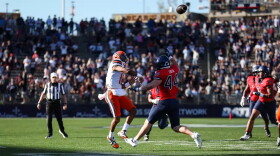 Syracuse quarterback Amari Odom (12, White) heaves a pass towards the end zone during SU’s 42-41 overtime win over UConn Saturday.