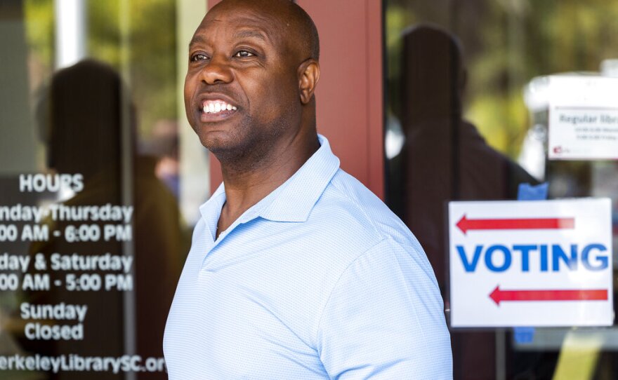 Sen. Tim Scott, R-S.C., waits in line for early voting at the public library in Hanahan, S.C., on Monday, Oct. 31, 2022. (AP Photo/Mic Smith)