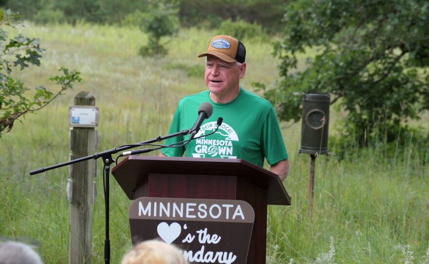 Gov. Tim Walz announces an executive order banning nonferrous mining near the Boundary Waters Canoe Area Wilderness at a news conference at the Belwin Conservancy near Afton State Park on Aug. 18, 2026.