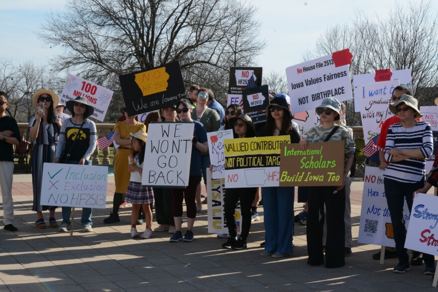 Mora then 100 attendees gathered outside the state capitol on March 21, 2026 to protest HF213. If passed, the bill would ban Iowa colleges from entering employment contracts with people from countries considered foreign adversaries or state sponsors of terrorism starting July 1st.