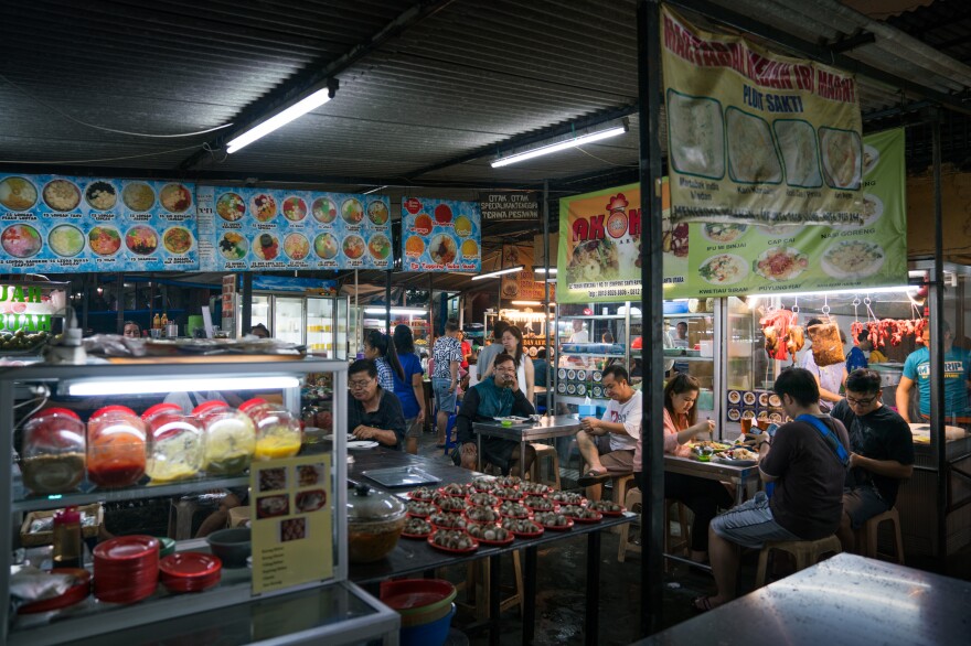 Dozens of hawkers sell dishes from all over the country at an outdoor food court in Jakarta, Indonesia.