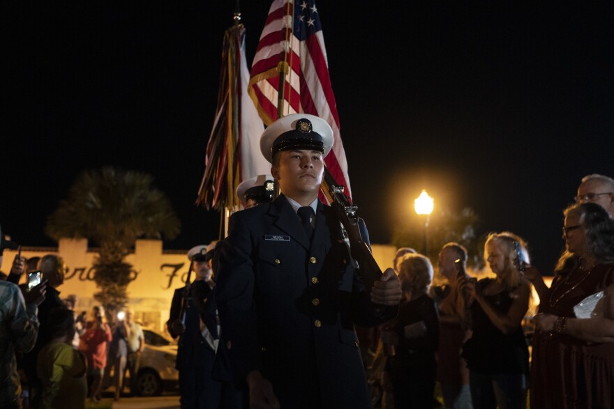 Members of the U.S. Coast Guard present colors during the dedication ceremony of a Third Order Fresnel Lens at the Port Isabel Lighthouse Historic Site in Port Isabel, Texas on Friday, Dec. 9, 2022. This is the first time in 117 years that the lens is being relit after the Texas Historical Commission and the Port Isabel Lighthouse State Historic Site were able to obtain a new lens for the lighthouse. &#13;Verónica G. Cárdenas for Texas Public Radio