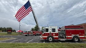 The Perry Township Fire Department raises an American flag at the Lloyd Expressway and Boehne Camp Road, Sept. 11, 2026