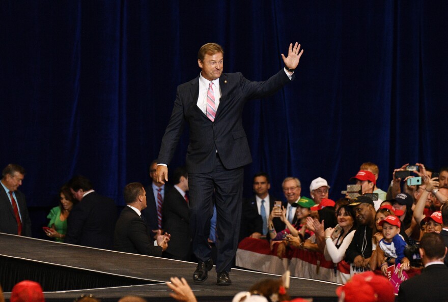 Dean Heller waves as he arrives at a rally with Trump (not pictured) in Las Vegas on Sept. 20. He is the only Republican in the Senate up for re-election in a state that Hillary Clinton won.