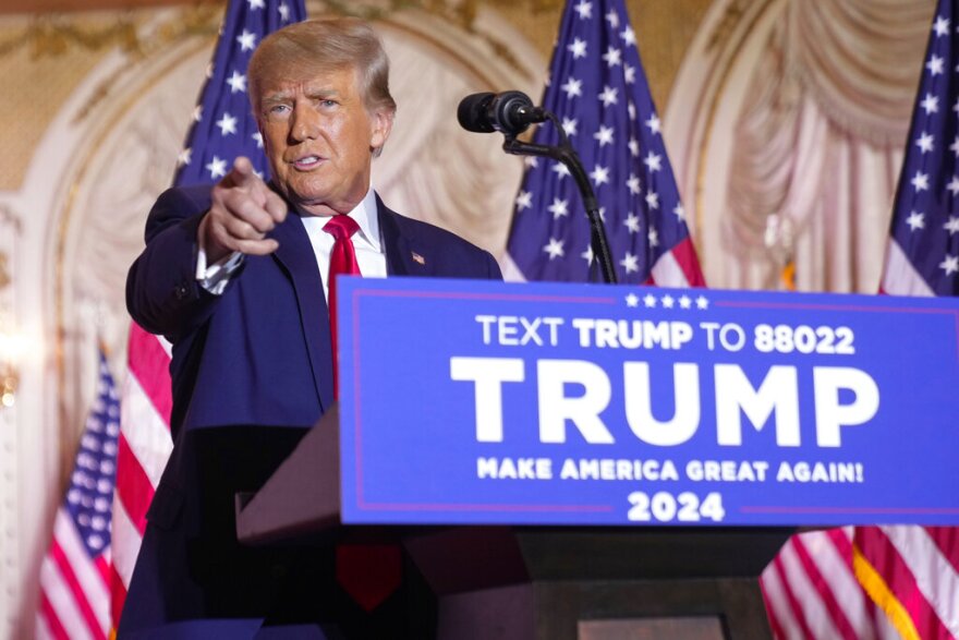 FILE - Former President Donald Trump gestures as he announces he is running for president for the third time as he speaks at Mar-a-Lago in Palm Beach, Nov. 15, 2022. Trump is set to kick off his 2024 White House bid with visits to a pair of early voting states. The appearances on Saturday, Jan. 28, 2023, will mark Trump's first campaign events since launching his bid more than two months ago. (AP Photo/Andrew Harnik, File)