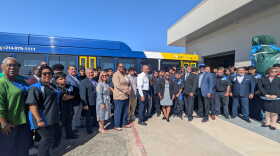 A group photo of DART and DISD leaders posing with students enrolled in the new career and technical education program.
