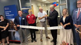 James Henningsen (third from right)President of the College of Central Florida and 2025-2026 Board of Trustees member Rusty Branson cutting the ribbon, officially opening the new Center for Career Development at the CF Ocala Campus Enterprise Center. (Jake Hoffman/WUFT News)
