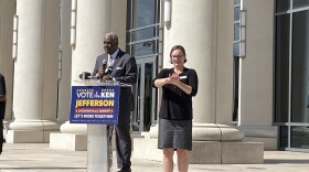 Ken Jefferson announces his candidacy on the steps of the Duval County Courthouse, flanked by sign language interpreters.