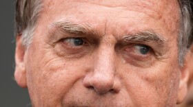 FILE - Brazil's former President Jair Bolsonaro, temporarily allowed out of house arrest for medical treatment, departs a hospital in Brasilia, Brazil, Sept. 14, 2025. (AP Photo/Eraldo Peres, File)