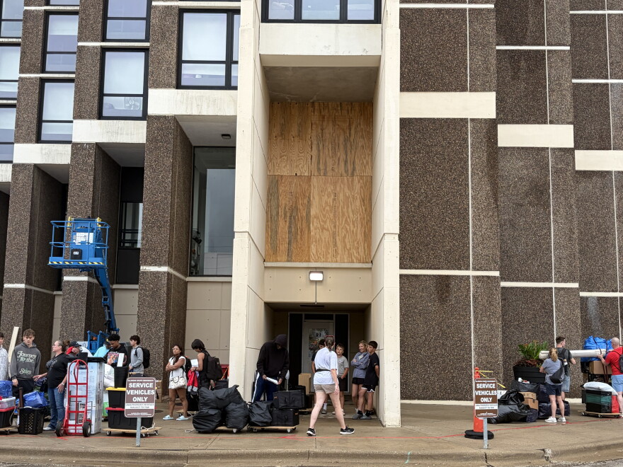 A damaged window at Illinois State University's Watterson Towers is seen boarded up Friday morning, Aug. 14, 2026.