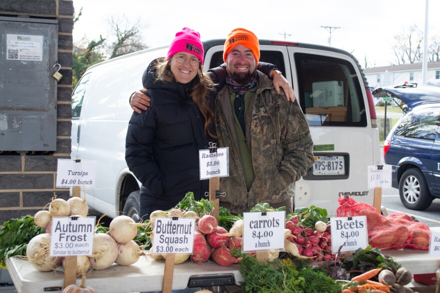 Sarah Golibart Gorman, left, is the marketing strategist for the Harrisonburg Farmers Market, where Curtis Yankey sells his farm products from North Mountain Produce in Timberville.