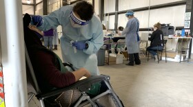 Victoria Barajas, a medical assistant at Klamath Health Partnership, tests farmworkers for COVID-19 in late September.