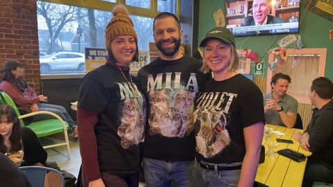 Local cat fans Sarah Swarthout, Anthony Roberts and Shaye Sumner came to the Cleveland Cat Club meeting sporting shirts their with their cats' faces on them.