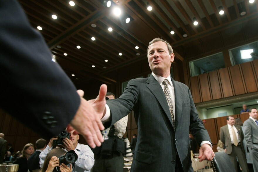 Supreme Court nominee John Roberts shakes Sen. Chuck Schumer's hand at Roberts' confirmation hearing in September 2005.