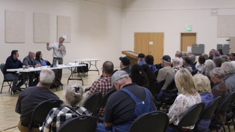 Attendees listen to Kenai Peninsula Borough Mayor Peter Micciche speak during a town hall on Monday, Aug. 17, 2026 in Sterling, Alaska.