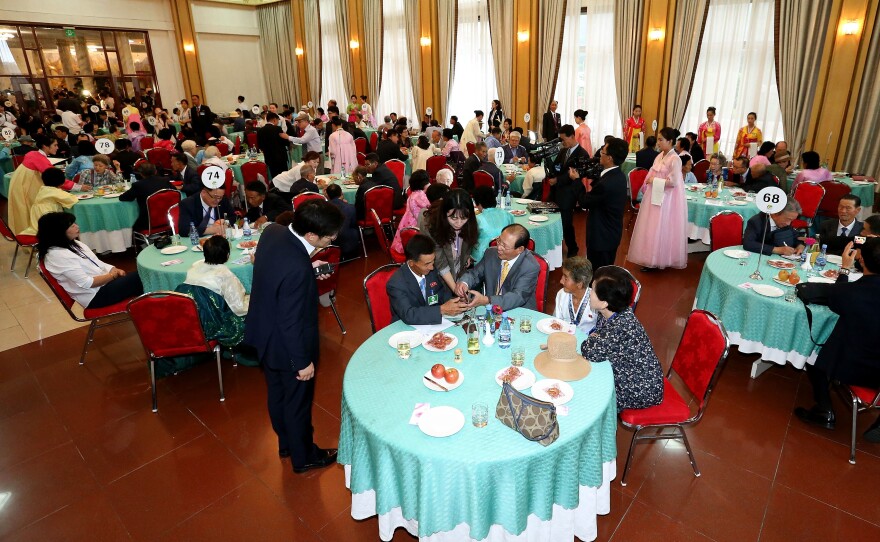 Nearly 90 South Koreans crossed the heavily armed border to see family members for the first time since the 1950-53 Korean War, during a family reunion at Mount Kumgang resort in North Korea on Monday.