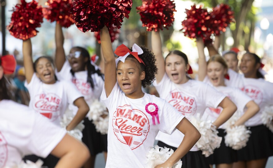 Williamsport cheerleaders march in the Little League World Series parade.