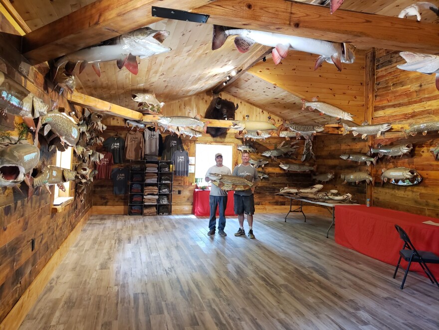 Brothers Chris Lax (left) and Rick Lax (right) of Lax Taxidermy in the showroom with dozens of musky replicas.