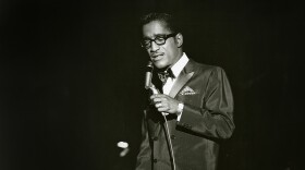 Sammy Davis Jr. singing onstage at the Sands Hotel in Las Vegas, most likely in the 1960s.
