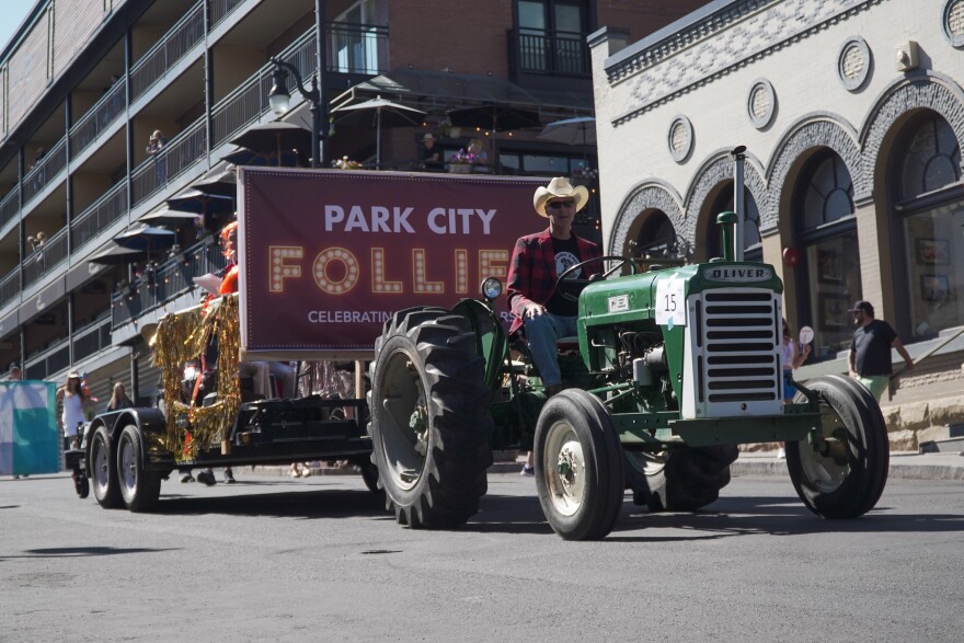 Actors and participants in the annual town farce, "Park City Follies," roll down Main Street on Miners Day 2025.