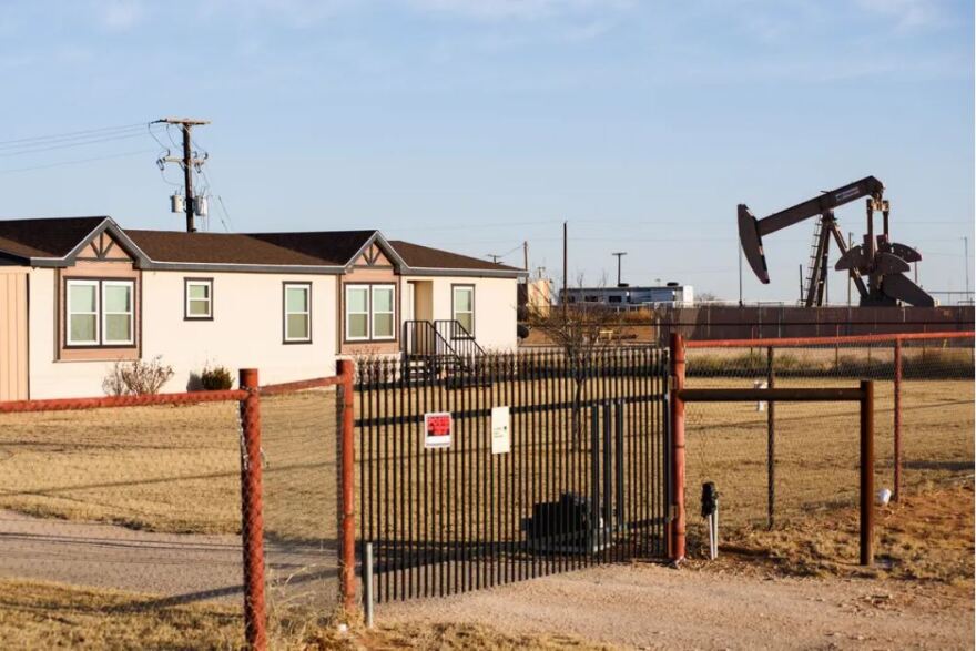  A pumpjack next to a home in Gardendale. Texas is the nation’s top natural gas producer but the state has started exporting more of it to other countries, which contributes to rising utility costs for Texans. 