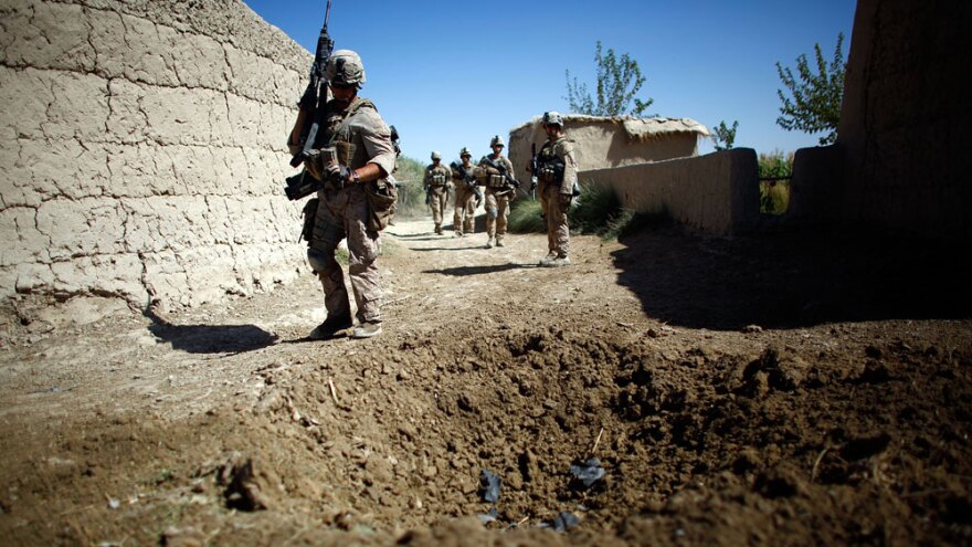 Marines on patrol in Afghanistan's Helmand province walk near a blast crater from a homemade  explosive device. Roadside bombs are the leading killer of U.S. troops in Iraq and Afghanistan. The American military has turned to mathematics and social network analysis to help identify bombers and their supporters.