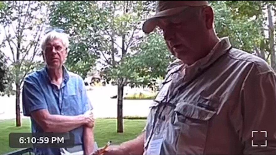Two canvassers are seen last year on Michelle Garcia's front-door camera in in Pueblo, Colo. The men said they were "doing a voter verification project."