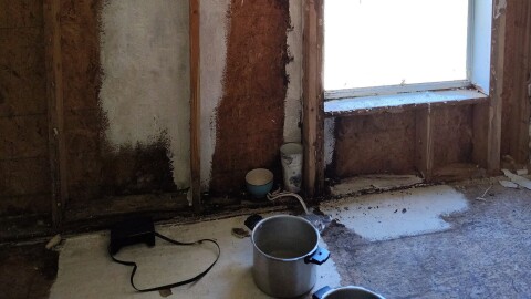 A damaged wall in Cherie Pensler’s mobile home. She resorted to ripping out drywall and excessively cleaning her home to deal with mold from a roof leak.