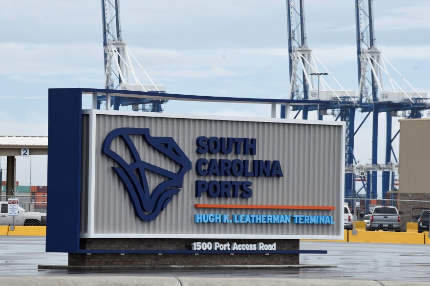 FILE - A sign marks the site of a new South Carolina Ports Authority terminal named for longtime state Sen. Hugh Leatherman on Monday, Oct. 25, 2021, in North Charleston, S.C. Work has finished on deepening the ship channel leading to the port to 52 feet so the world's largest ships can continue to dock there. (AP Photo/Meg Kinnard, File)